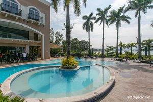 The Lighthouse Marina Resort in Luzon, image may contain: Hotel, Resort, Villa, Pool
