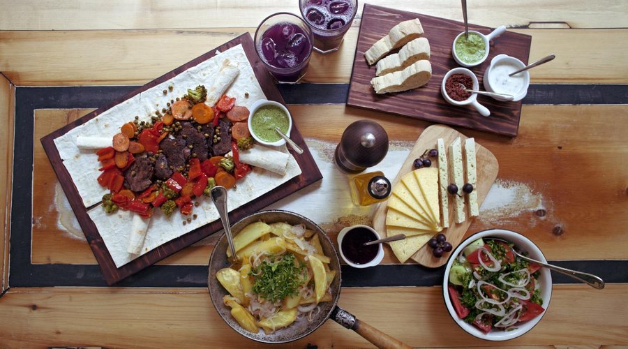 BeefSteak with vegetables, fried potato with onion, georgian salad and very special cheese.