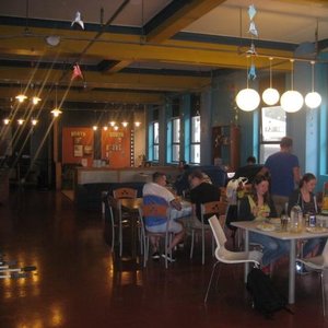 dining area with cute lights, ping pong table and lots of plugs to use your computer