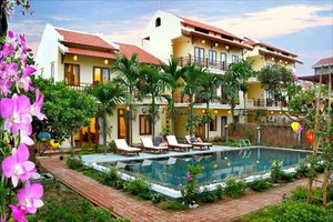 Villa Orchid Garden Riverside in Hoi An, image may contain: Resort, Villa, Hotel, Chair