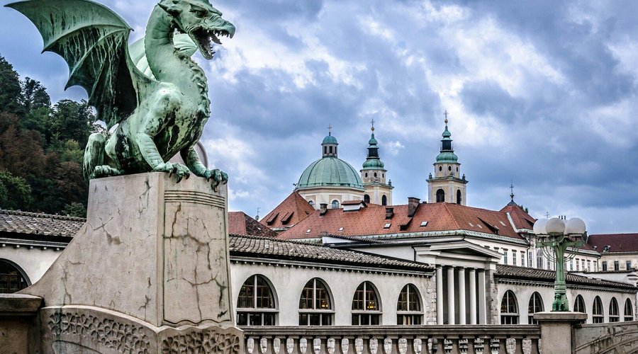 The famous Dragon Bridge (Zmajski Most) in Ljubljana, with its iconic dragon statues at each corner.