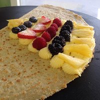 Gluten free crêpe with homemade cheesecake, and organic pineapple, blueberries, blackberries, ra