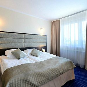 Hotel Ikar in Bydgoszcz, image may contain: Home Decor, Cushion, Furniture, Bed