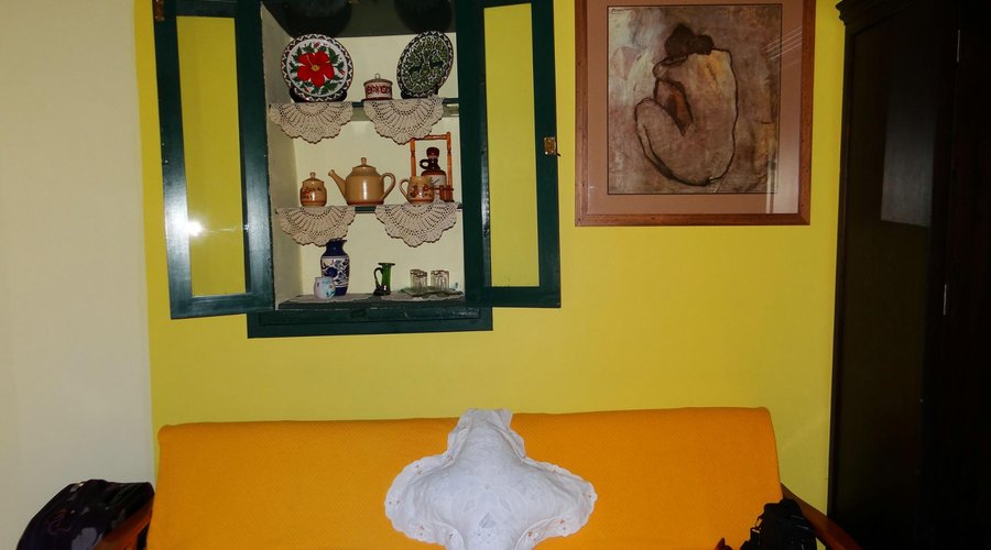 The couch and wall niche shelf