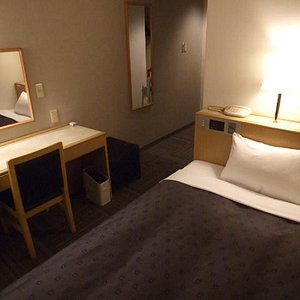 Court Hotel Mito in Mito, image may contain: Chair, Furniture, Dorm Room, Bed