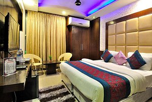 Check In Room Main Bazar in New Delhi, image may contain: Lighting, Chair, Furniture, Bedroom