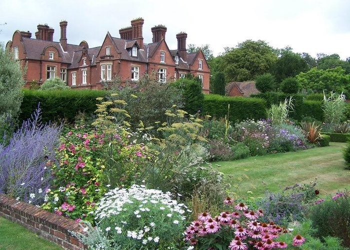 The gardens and house of Doddington Place Gardens, home of The Hawking Centre.