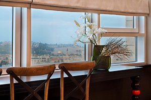 21st Floor Hotel in Jerusalem, image may contain: Window, Flower Arrangement, Windowsill, Potted Plant