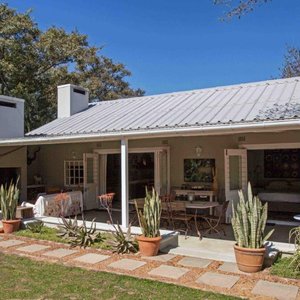 Beautifully appointed two bedroom cottage with generous veranda with patio table and combination
