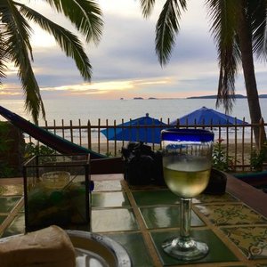 Dining on the porch, beach view.