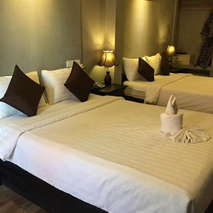 Vacation Boutique Hotel in Phnom Penh, image may contain: Bed, Furniture, Hotel, Cushion