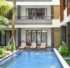 Kamarkoe Hotel Seminyak in Seminyak, image may contain: Villa, Pool, Chair, Swimming Pool