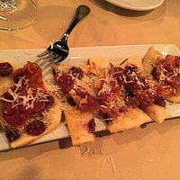 Flatbread with speck, roasted grapes, and blu cheese. Excellent!