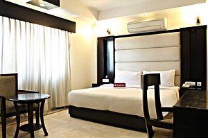 Hotel Meridian Plaza in New Delhi, image may contain: Home Decor, Interior Design, Furniture, Cushion
