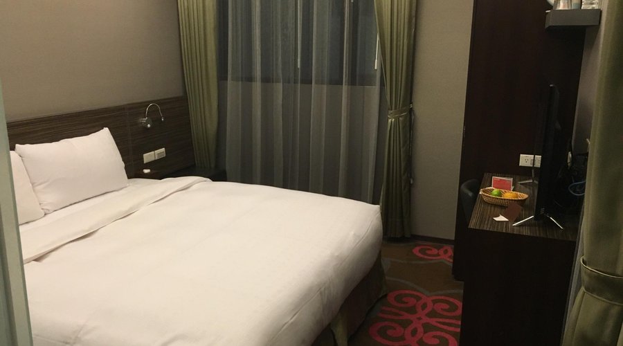 Nice boutique hotel direct opp Subway station! Right opposite night market! Small room come balc