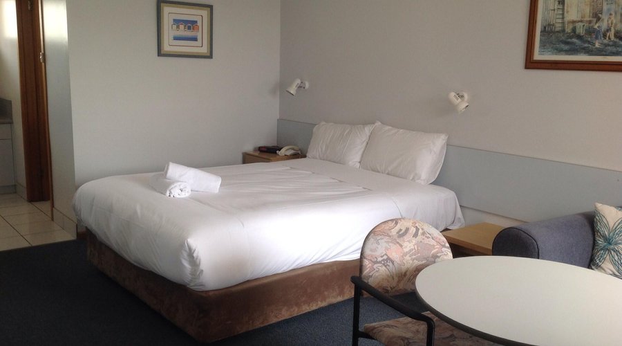 Our room with bed, lounge and table