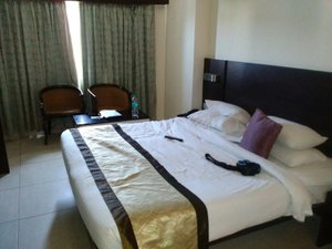 TSG Emerald View Hotel & Spa in South Andaman Island, image may contain: Chair, Furniture, Bed, Bedroom
