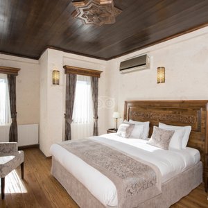 Osmanli Cappadocia Hotel in Goreme, image may contain: Interior Design, Wood, Furniture, Lamp