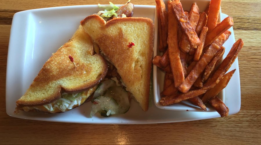 Turkey club sandwich with sweet potato fries