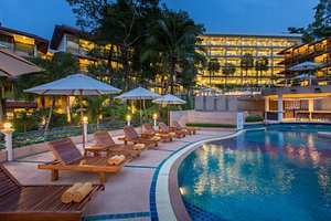 Chanalai Flora Resort, Kata Beach, Phuket in Phuket, image may contain: Hotel, Resort, Chair, Pool