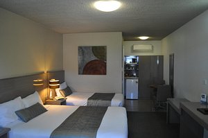 In Town Motor Inn in Taree, image may contain: Bed, Furniture, Lighting, Chair