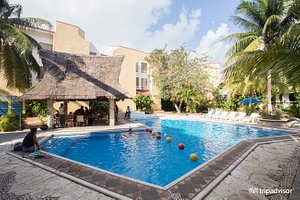 Hotel Plaza Caribe in Cancun, image may contain: Villa, Hotel, Resort, Person