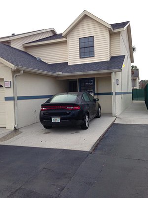 Pines, Aparthotel in Kissimmee, image may contain: License Plate, Garage, Indoors, Car