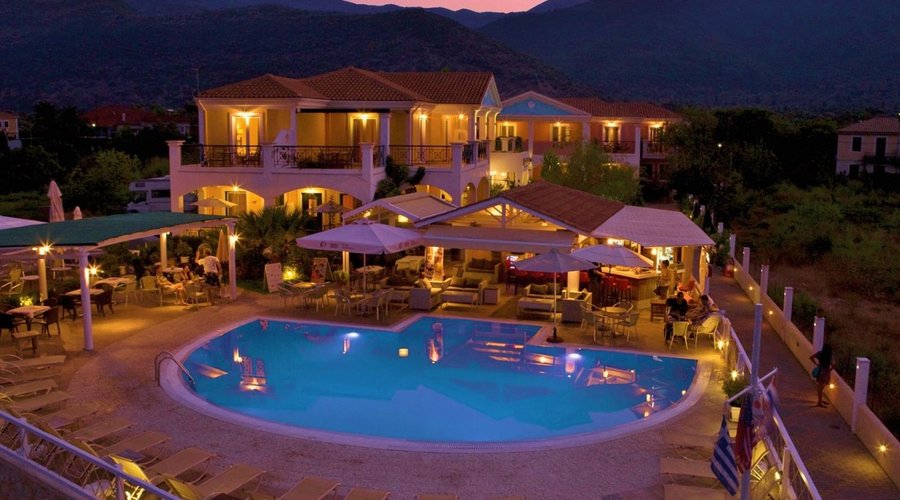 The Iris Hotel at night with a view of the mountains
