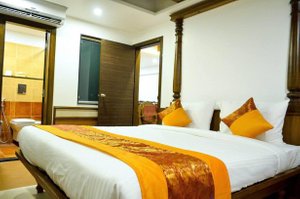 Hotel Sepoy Grande by Yuvraj Group of Hotels in Mysuru (Mysore), image may contain: Hotel, Resort, Furniture, Bed