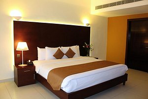 Sohar Beach Hotel in Sohar, image may contain: Furniture, Home Decor, Lamp, Hotel