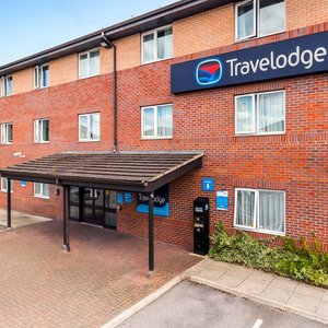 Travelodge Bury in Bury, image may contain: Car, Vehicle, Housing, Building