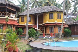 Krishnatheeram Ayur Holy Beach Resort in Varkala Town, image may contain: Resort, Hotel, Building, Villa
