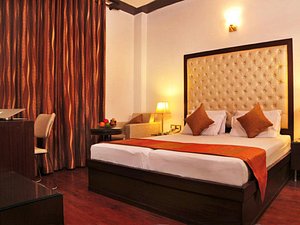 OYO 44081 Hotel Royal Holidays in New Delhi, image may contain: Hotel, Resort, Interior Design, Bed
