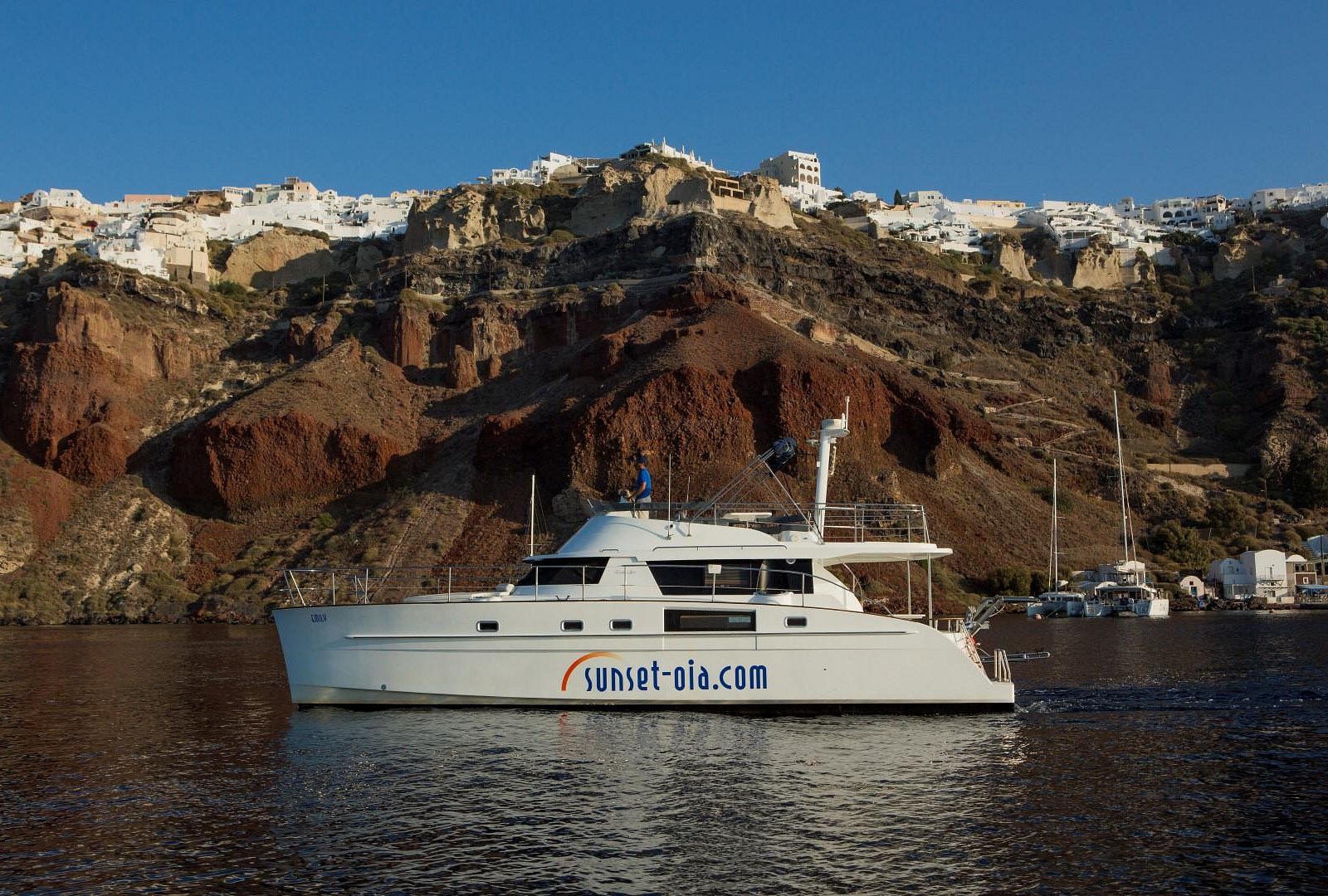 sunset oia sailing catamaran