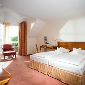 Landhaus Eggert in Muenster, image may contain: Chair, Furniture, Indoors, Bed