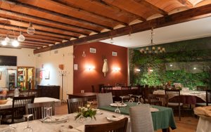 Las Aguas del Arbuniel in Arbuniel, image may contain: Restaurant, Dining Table, Table, Dining Room