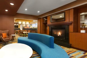 Fairfield Inn & Suites Midland in Midland, image may contain: Fireplace, Couch, Living Room, Hearth