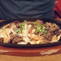 beef on hot sizzling grill