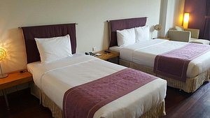 TTC Hotel - Ngoc Lan in Da Lat, image may contain: Bed, Furniture, Bedroom, Lamp