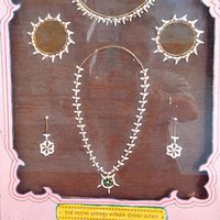 The jewels made from Shark fish's teeth. It's very well done and looks more nice in real.