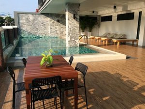 The Corner Lodge in Pattaya, image may contain: Villa, Table, Dining Table, Floor