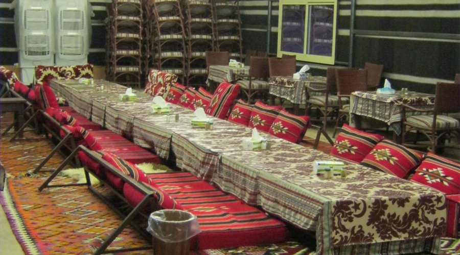 The dining tent offers on the floor seating and table seating