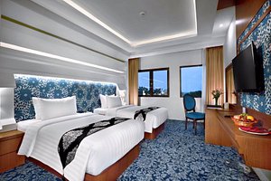 CK Tanjungpinang Hotel & Convention Centre in Bintan Island, image may contain: Monitor, Screen, Furniture, Bedroom