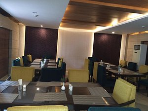 Hotel Parkview in Chandigarh, image may contain: Restaurant, Dining Room, Dining Table, Cafe