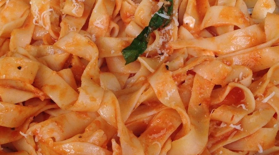 Linguini with basil and mozarella cheese
