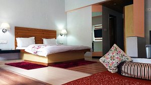 Spring Valley Resort in McLeod Ganj, image may contain: Home Decor, Cushion, Interior Design, Bed