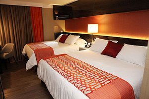 Sandri Palace Hotel in Itajai, image may contain: Hotel, Resort, Bed, Furniture