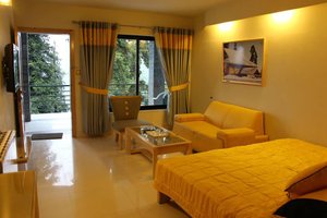 Summer Retreat Hotel Nathiagali in Nathia Gali, image may contain: Living Room, Bed, Couch, Chair