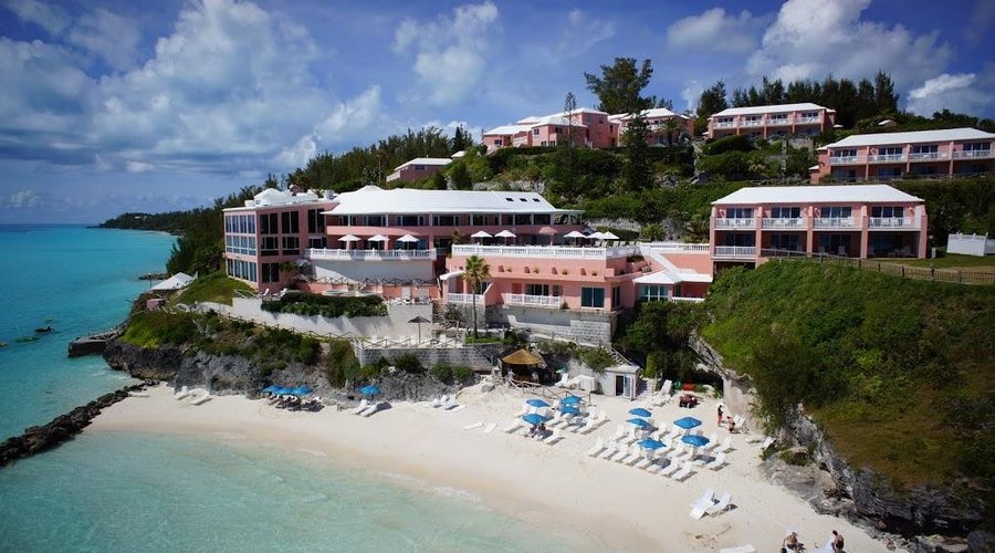 The resort's private beach has a tiki bar and complimentary use of lots of umbrellas and chaises