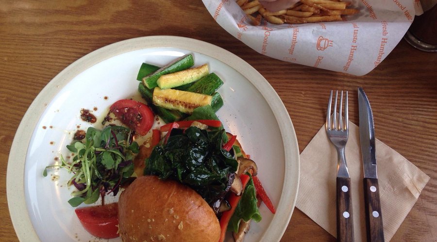 Veggie delicious burger. Mushrooms, eggplant, Zukini, many vegetables. Salad with balsamic and o